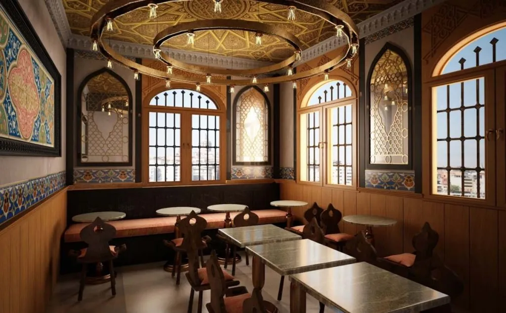 Ottoman-style dining room at Hatay Asi Künefeleri with a gilded ceiling, ring chandeliers, and arched windows