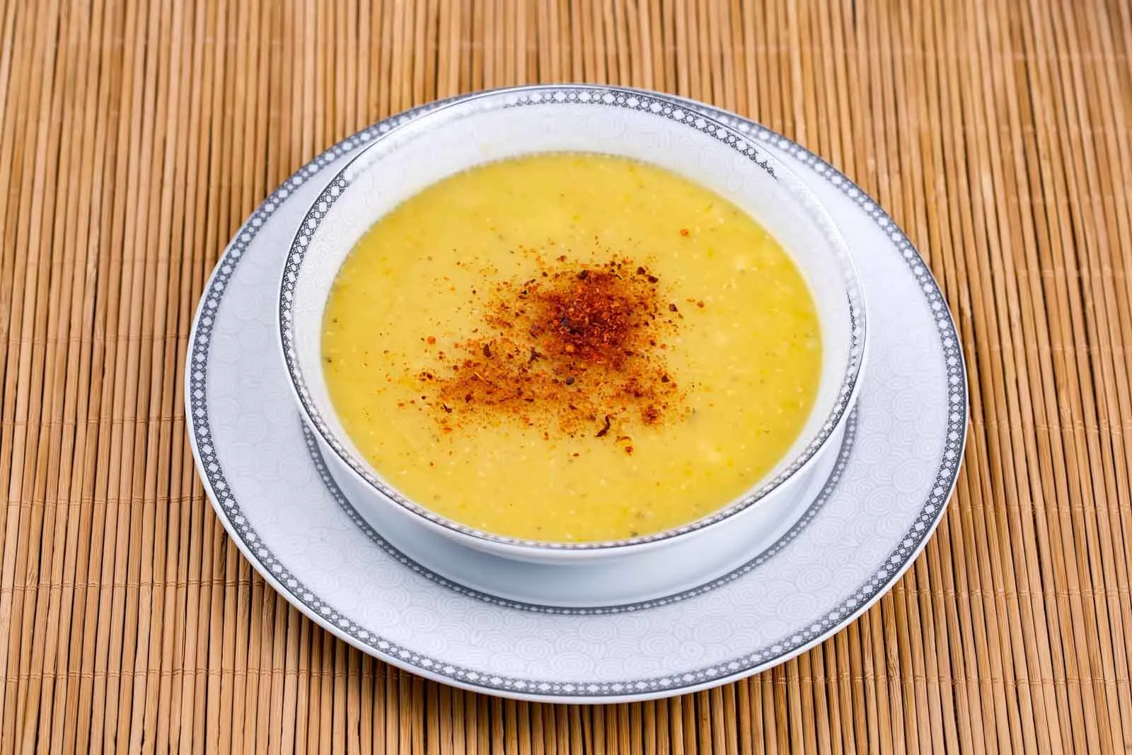 Turkish lentil soup in a bowl flavored with ground red pepper