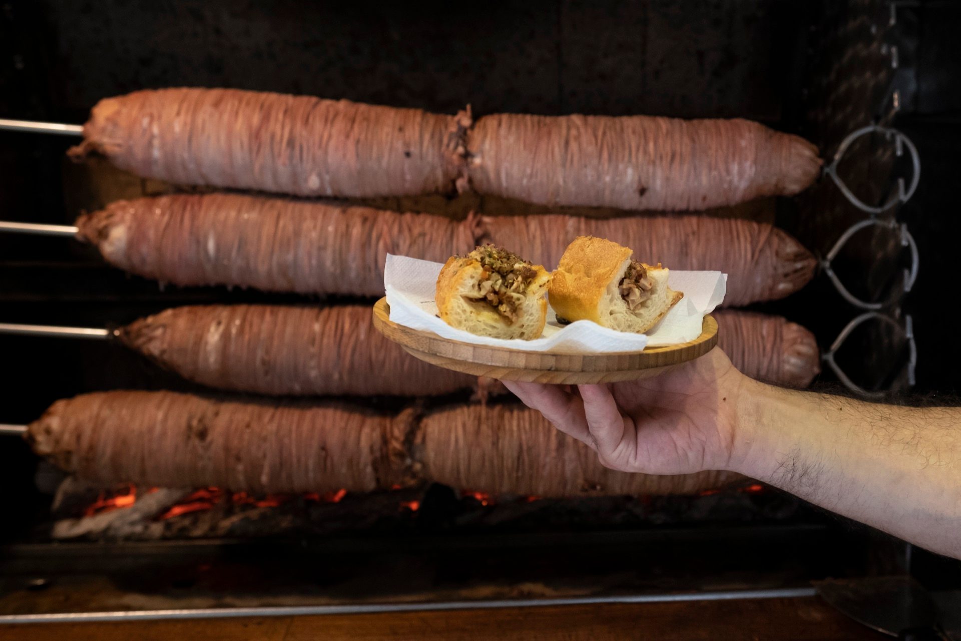 kokorec sandwich halves wooden board grill