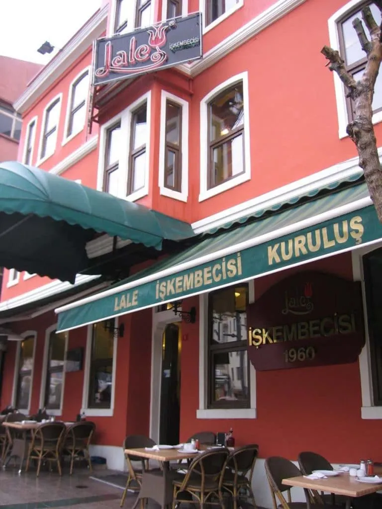 The red corner building of Lale İşkembecisi, with green awnings and the 1960 founding year on the sign